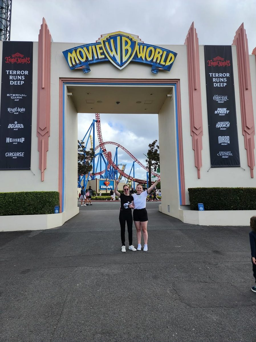 Two people at the entrance to Movie World on the Gold Coast